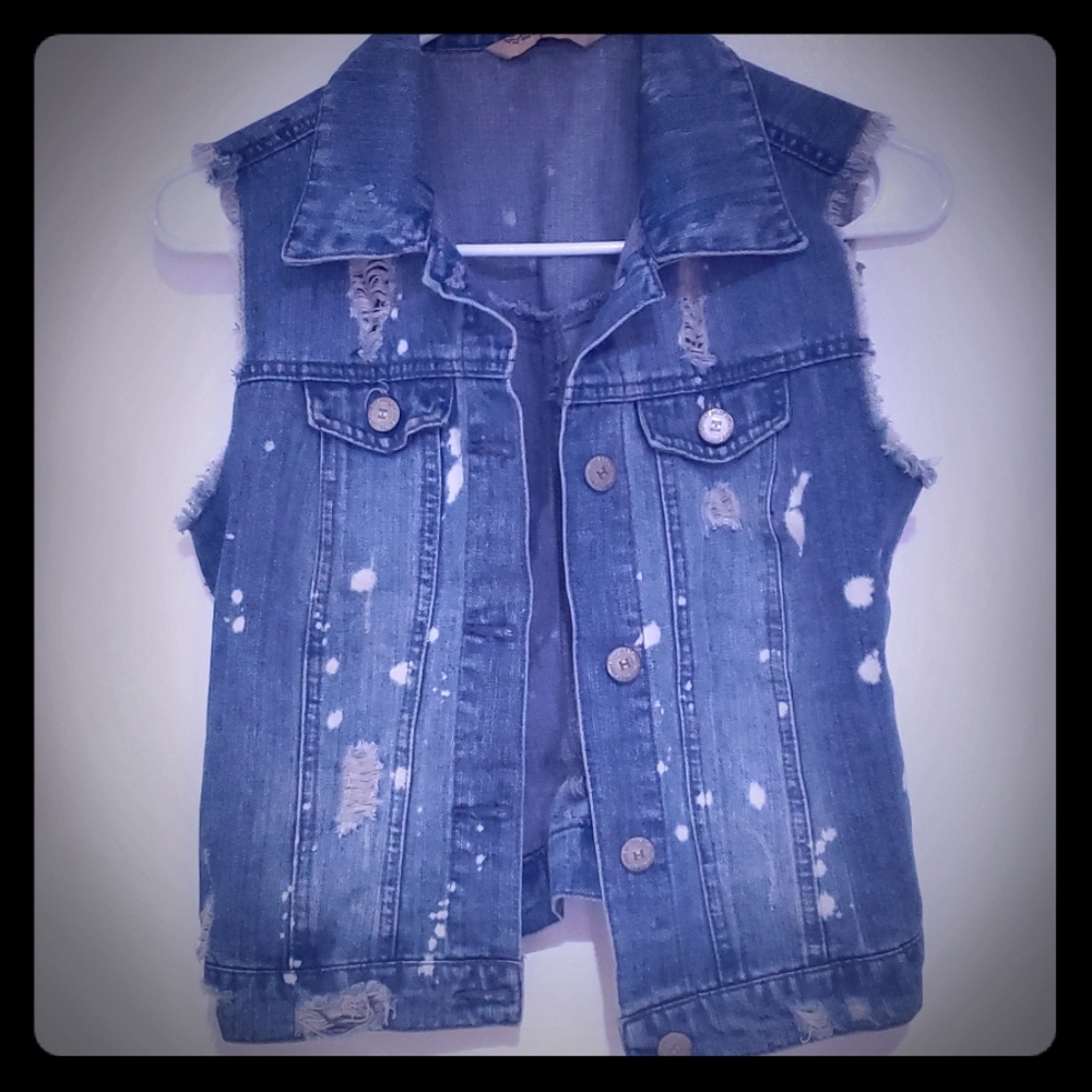 Versatile distressed denim vest